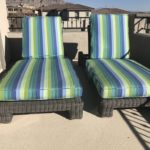 two blue and green outdoor lounge chairs