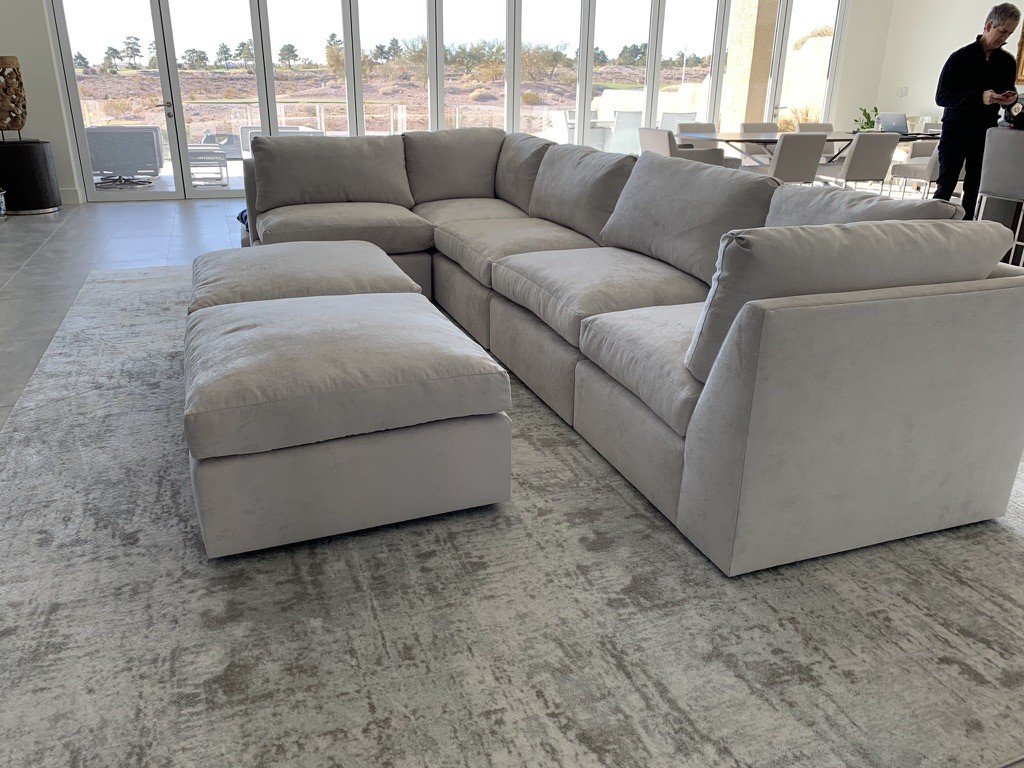 Light gray couch sofa inside a modern living room